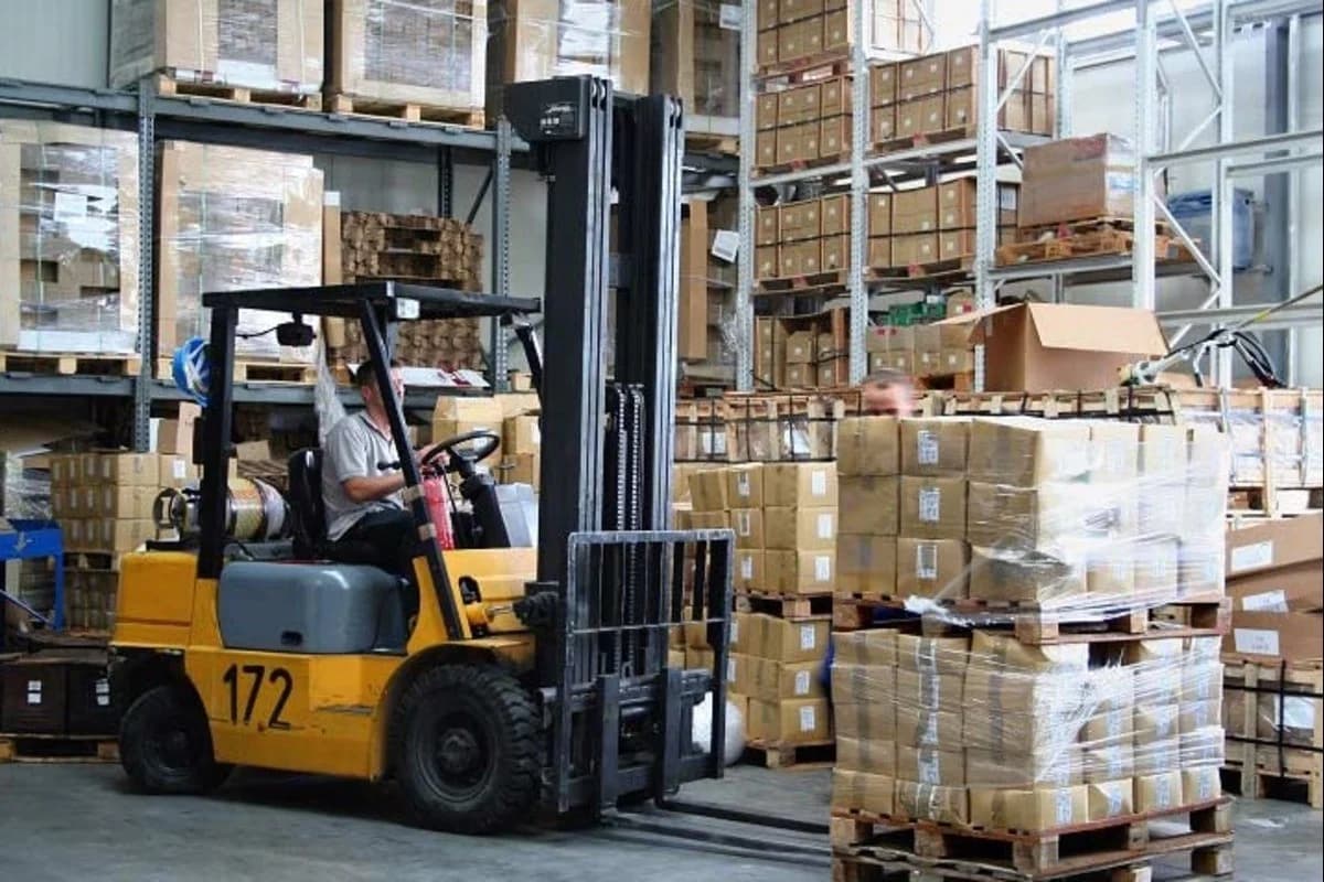 Forklift moving freight across a dock
